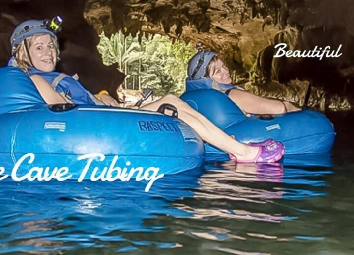 Guests cave tubing in Belize with helmets and tubes